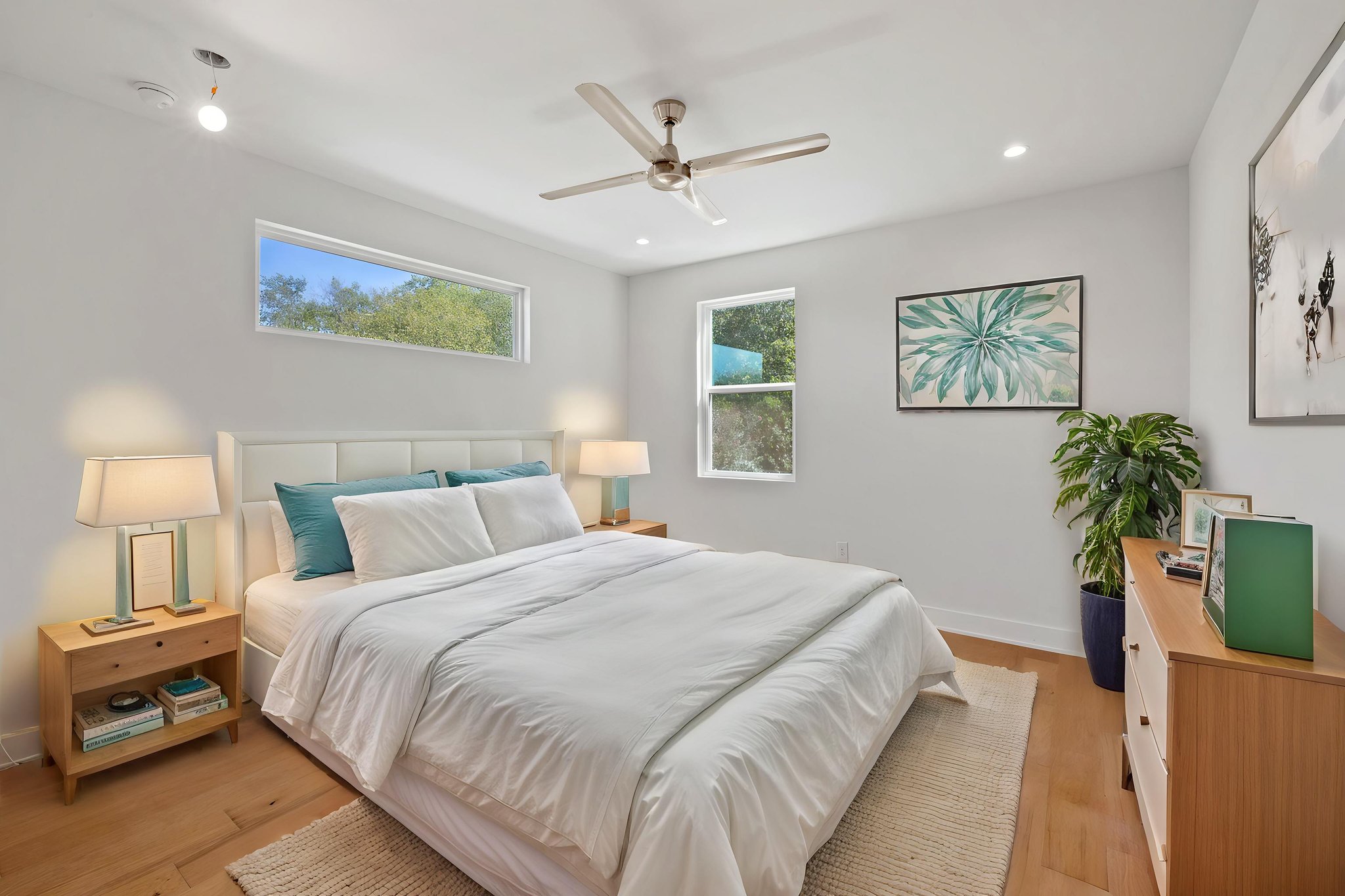 1719 Bunche Road Austin, TX 78721 - Photo 23 of 36 Warm hardwood floors and abundant natural light create a serene atmosphere in this bedroom.