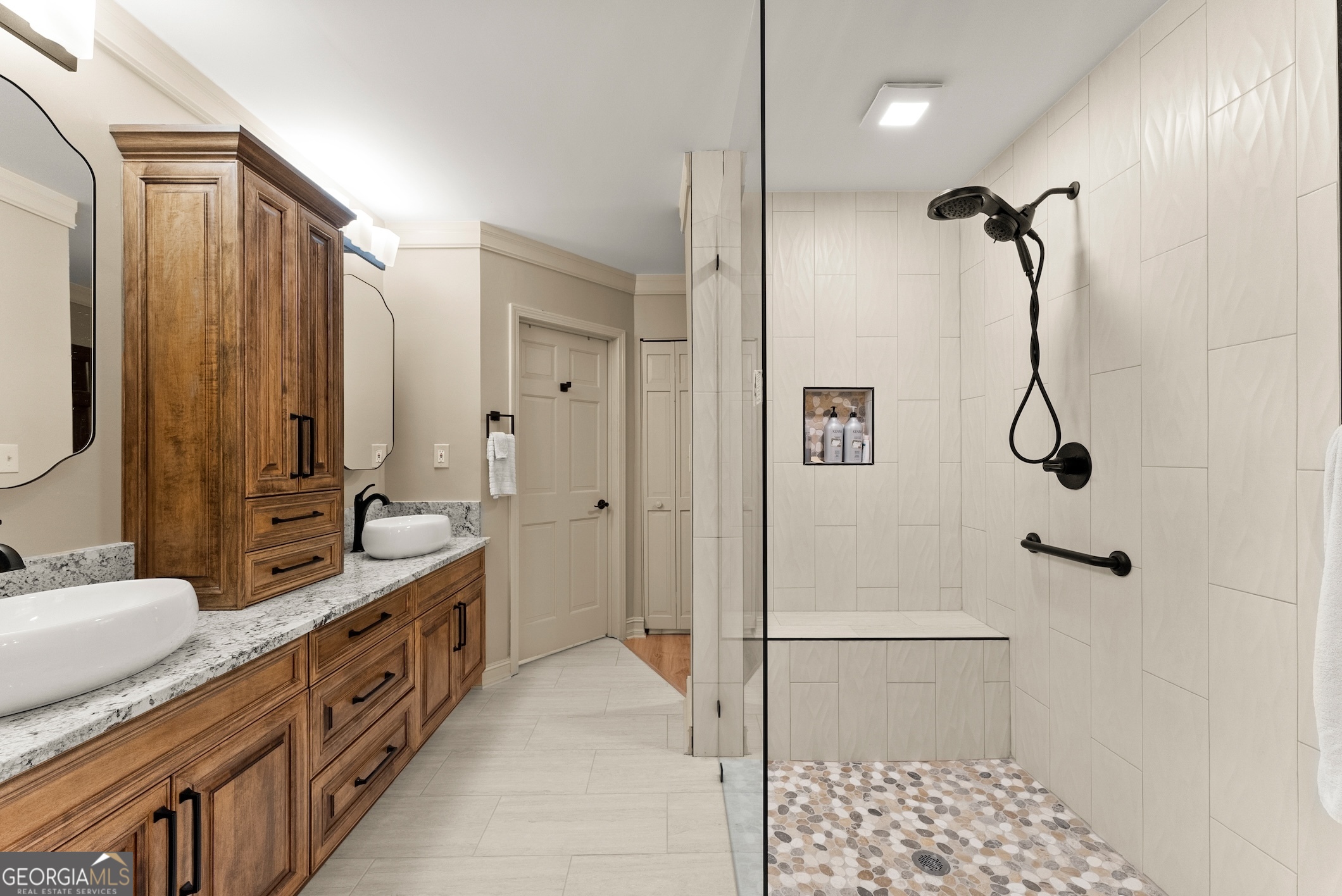 7215 Kelly Bridge Road Dawsonville, GA 30534 - Photo 16 of 87 a bathroom with a double vanity sink a mirror a bathtub and shower