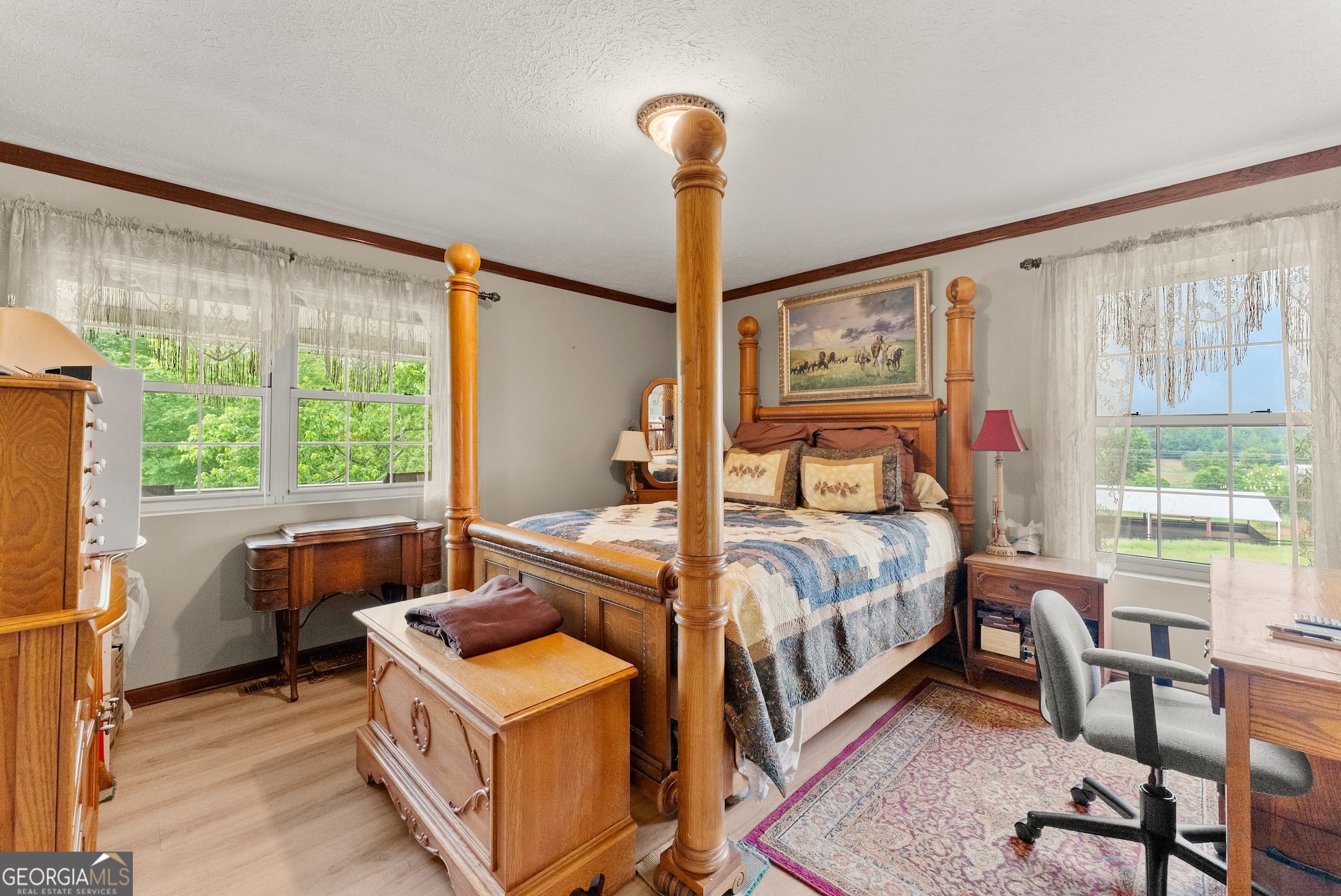 7215 Kelly Bridge Road Dawsonville, GA 30534 - Photo 35 of 87 a bedroom with a bed and wooden floor