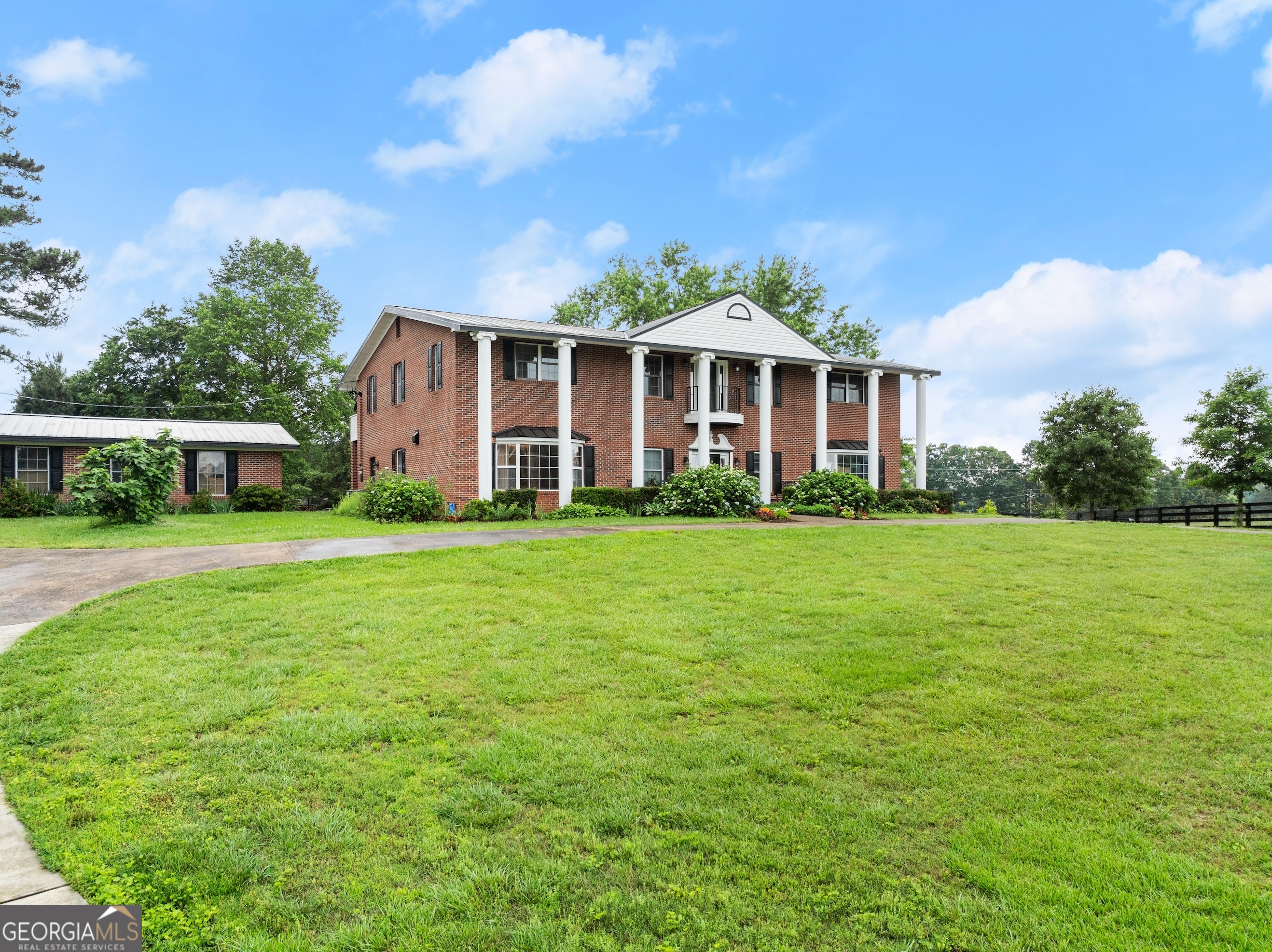 7215 Kelly Bridge Road Dawsonville, GA 30534 - Photo 4 of 87 a front view of a house with garden