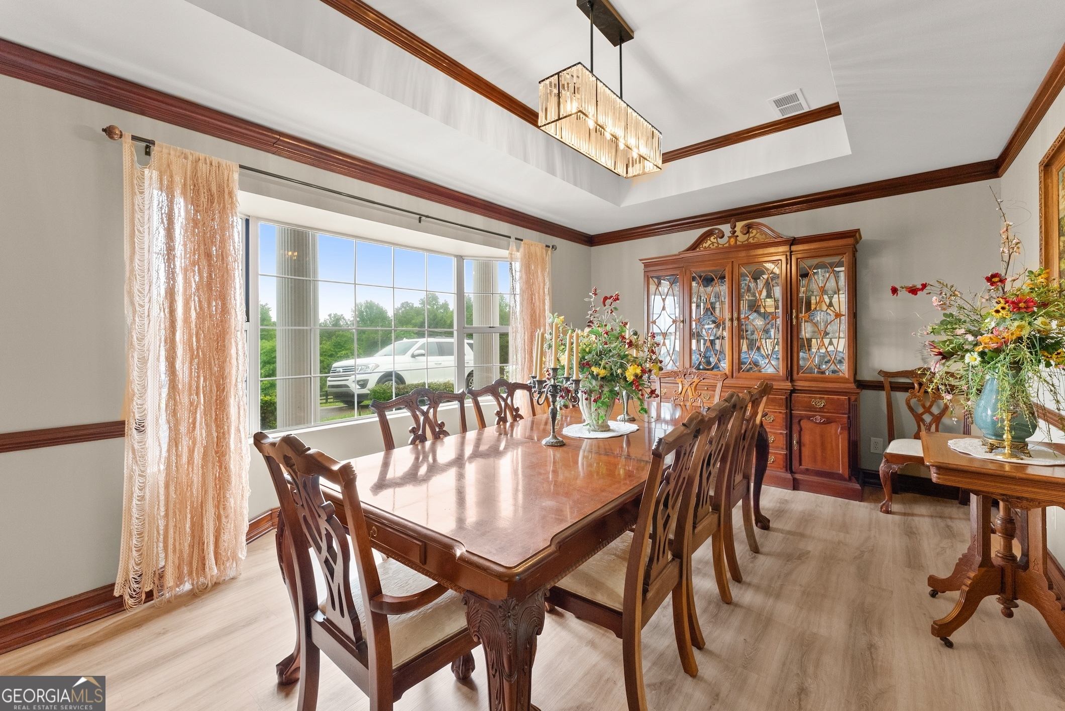 7215 Kelly Bridge Road Dawsonville, GA 30534 - Photo 43 of 87 a dining room with furniture window and wooden floor