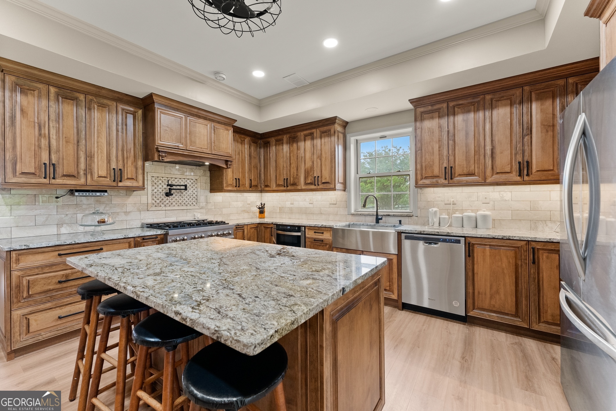 7215 Kelly Bridge Road Dawsonville, GA 30534 - Photo 46 of 87 a kitchen with granite countertop a stove a sink dishwasher and a refrigerator with wooden cabinets