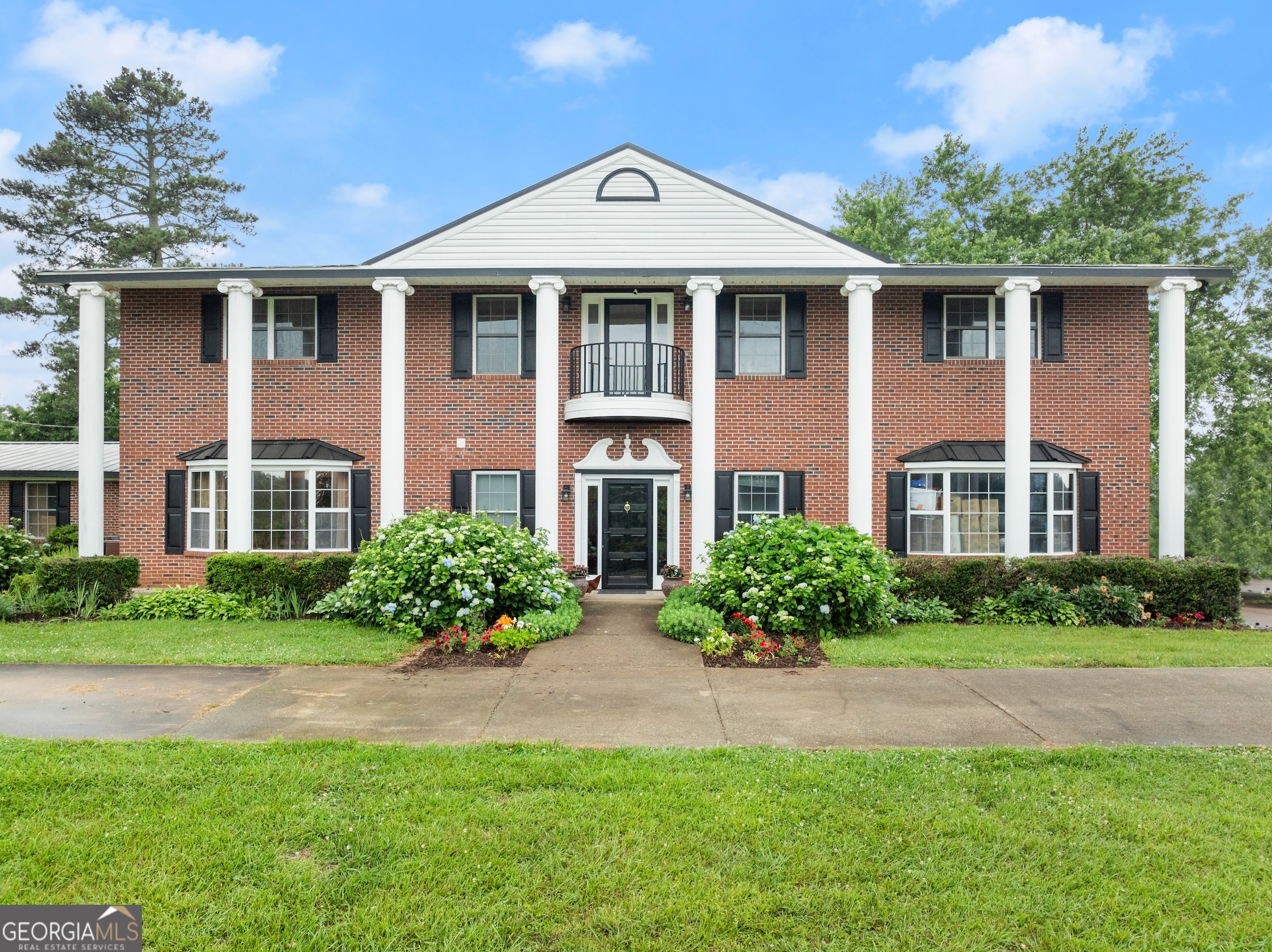7215 Kelly Bridge Road Dawsonville, GA 30534 - Photo 5 of 87 a front view of a house with a yard