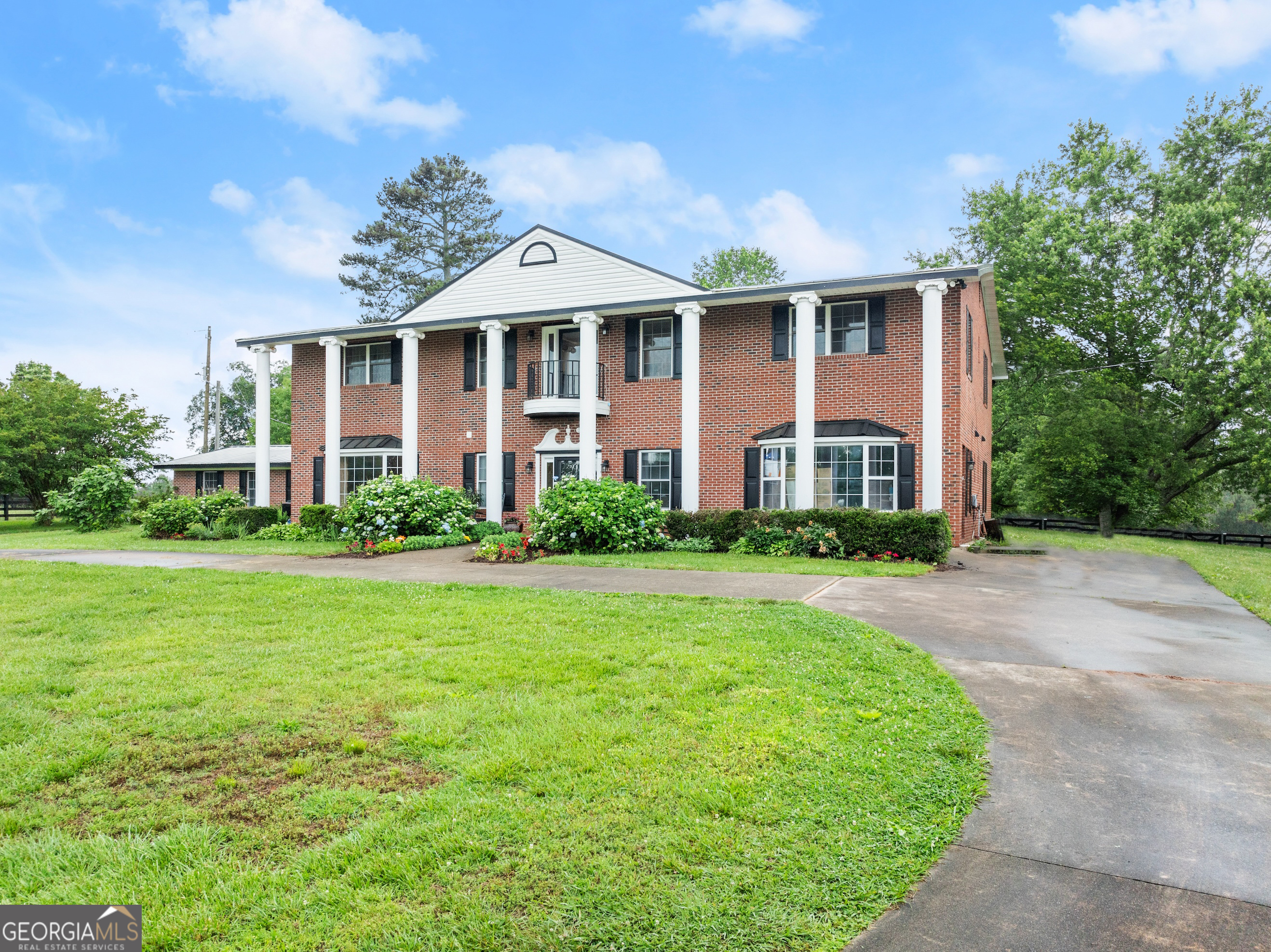 7215 Kelly Bridge Road Dawsonville, GA 30534 - Photo 85 of 87 a front view of a house with a yard and porch
