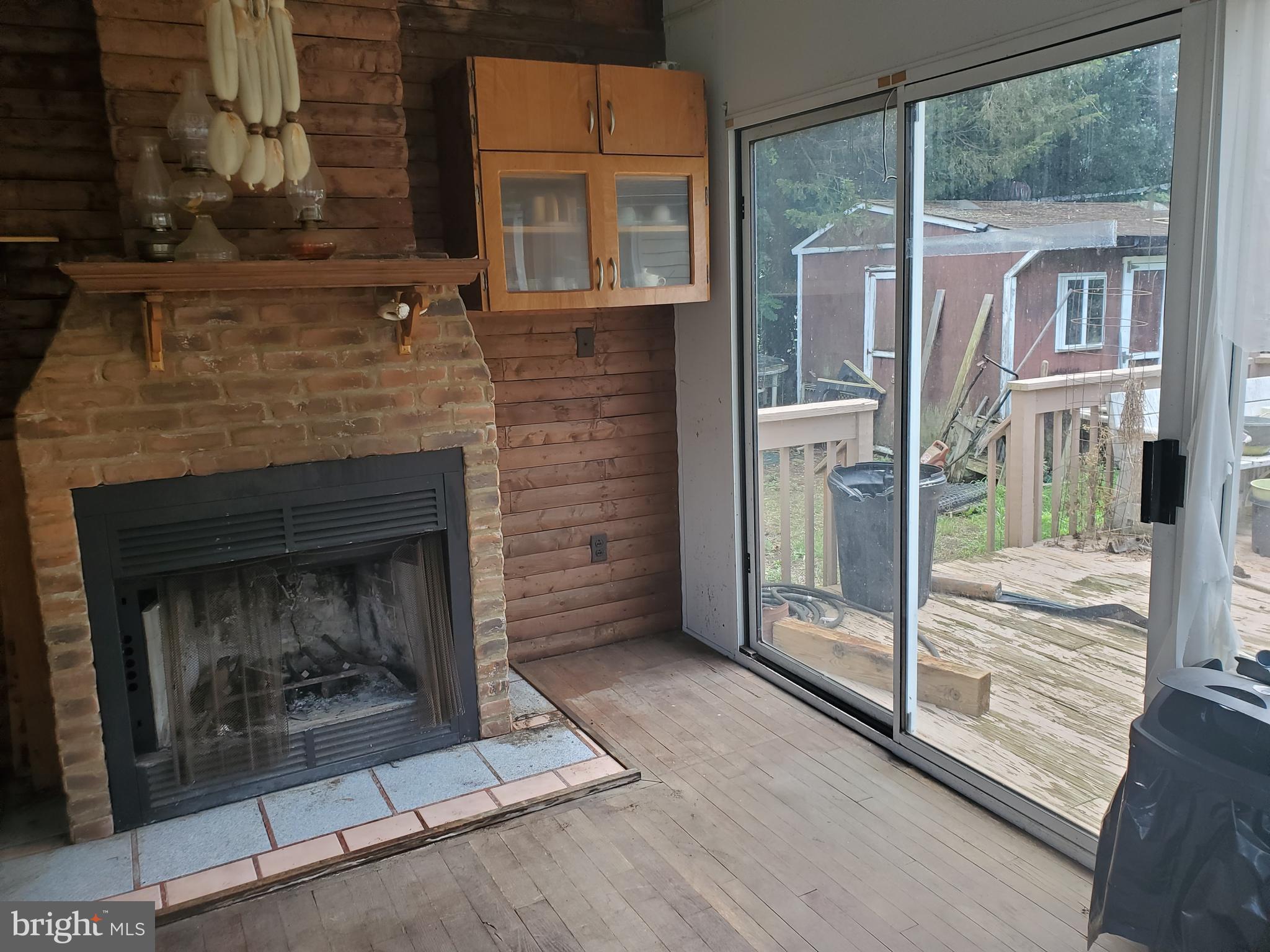 117 Reed Street Hightstown, NJ 08520 - Photo 5 of 7 Woodburning fireplace in sunroom