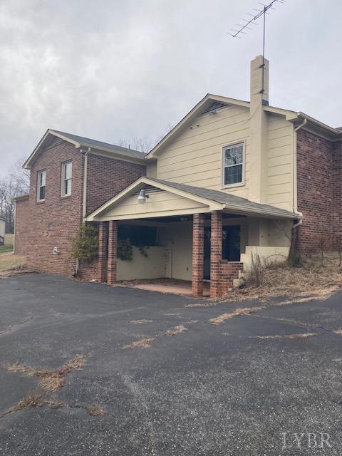 230 Deer Path Rustburg, VA 24588 - Photo 16 of 25 a front view of a house with garage