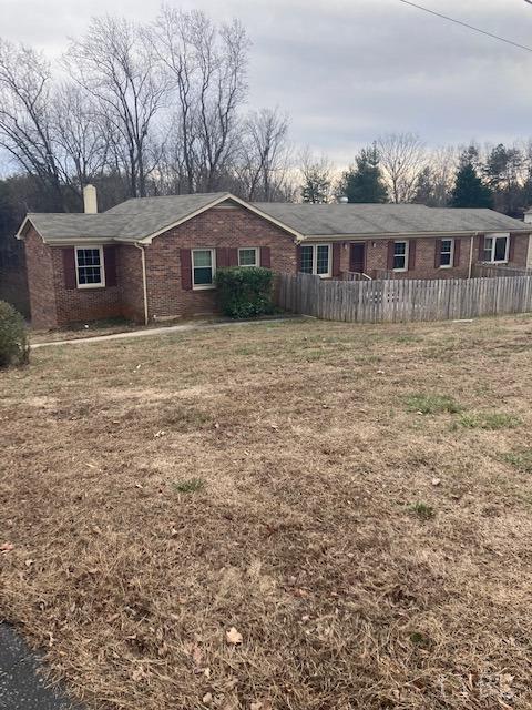 230 Deer Path Rustburg, VA 24588 - Photo 21 of 25 a front view of house with yard and trees in the background