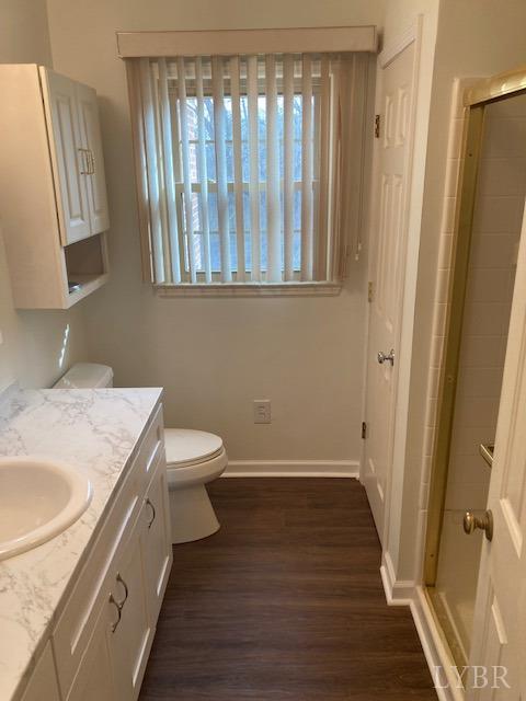 230 Deer Path Rustburg, VA 24588 - Photo 7 of 25 a bathroom with a granite countertop sink toilet and a mirror