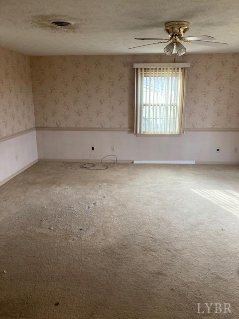 230 Deer Path Rustburg, VA 24588 - Photo 9 of 25 an empty room with windows and ceiling fan
