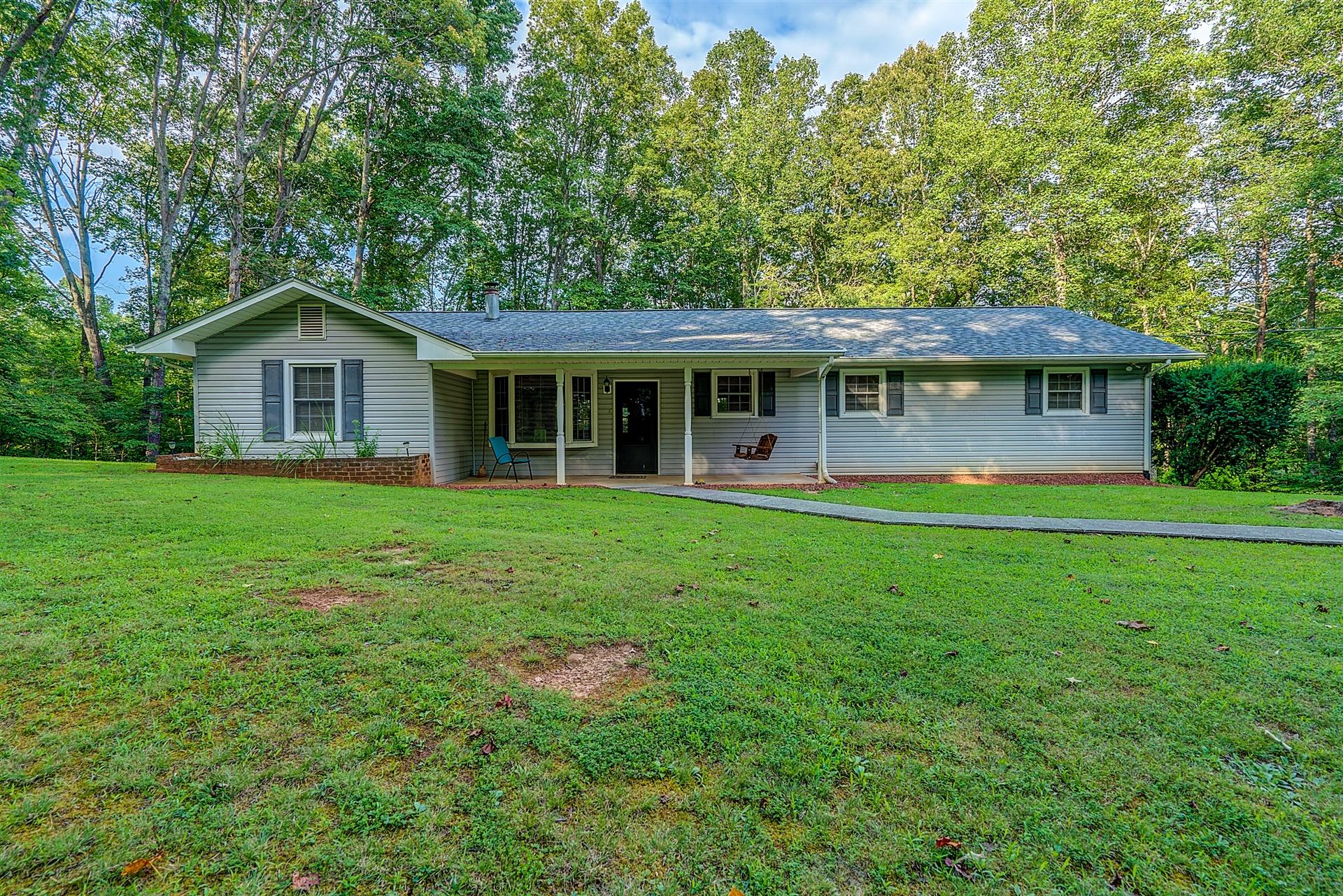 5960 Goodview Road Goodview, VA 24095 - Photo 1 of 38 a front view of house with yard and green space