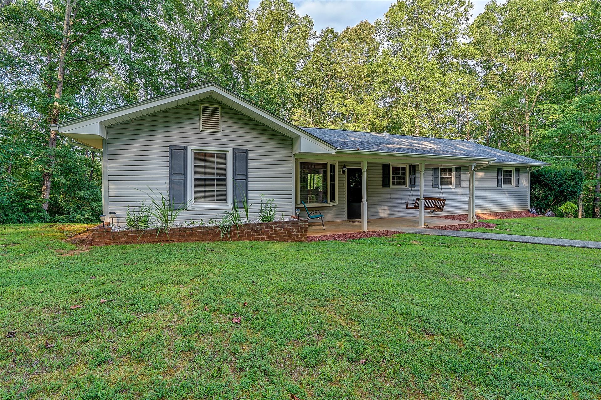 5960 Goodview Road Goodview, VA 24095 - Photo 2 of 38 a backyard of a house with yard and barbeque oven