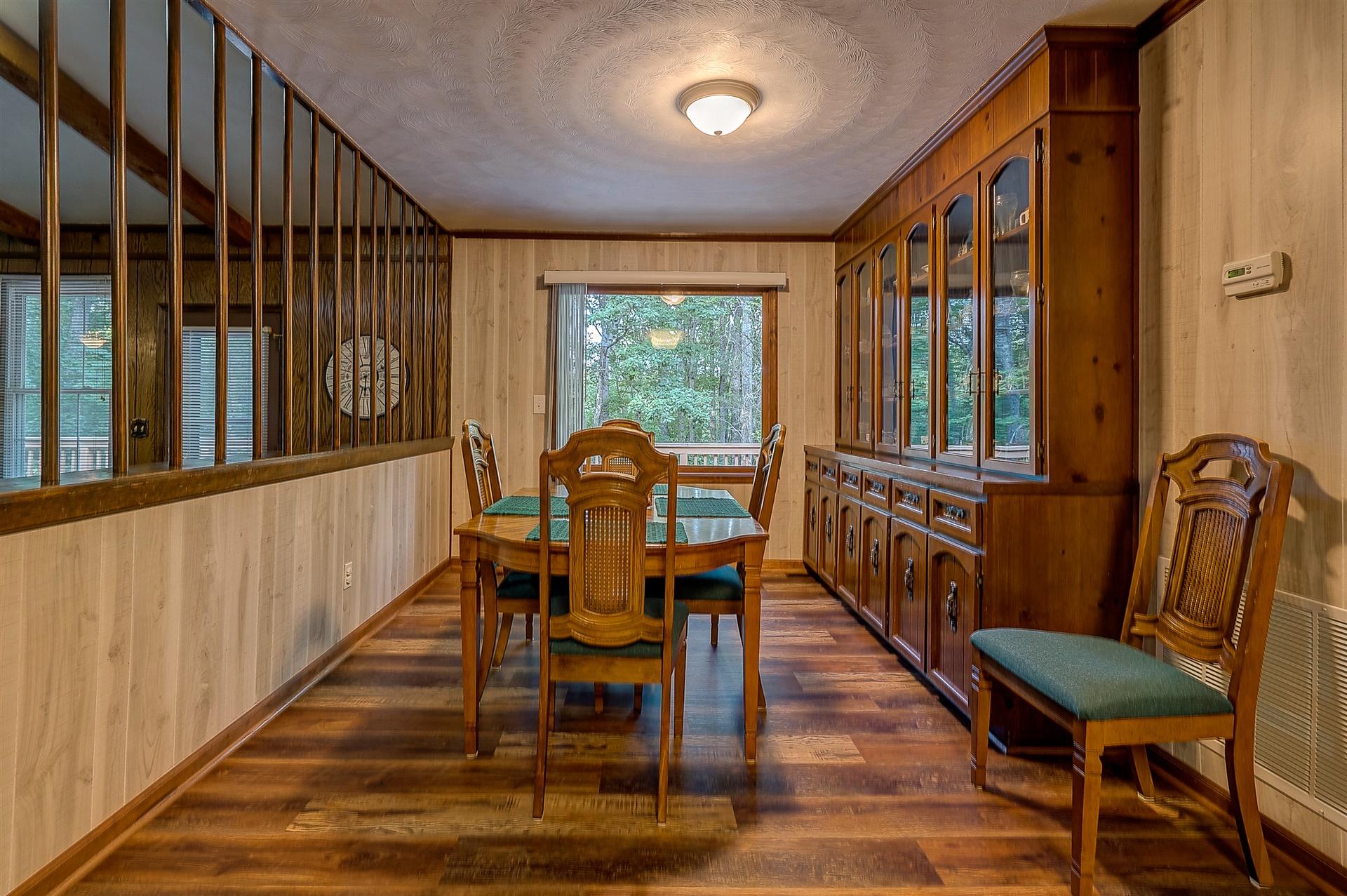 5960 Goodview Road Goodview, VA 24095 - Photo 12 of 38 a view of a dining room with furniture window and wooden floor
