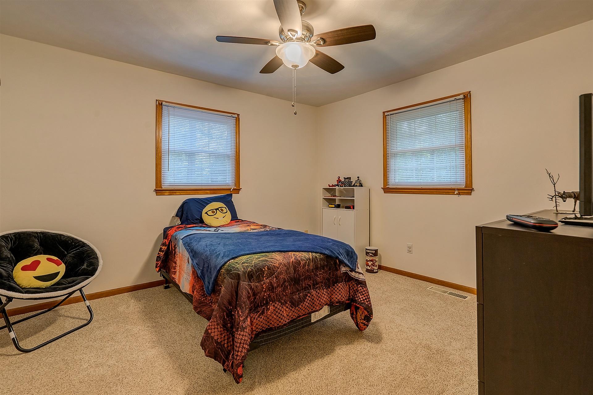 5960 Goodview Road Goodview, VA 24095 - Photo 21 of 38 a bedroom with a bed and cabinets