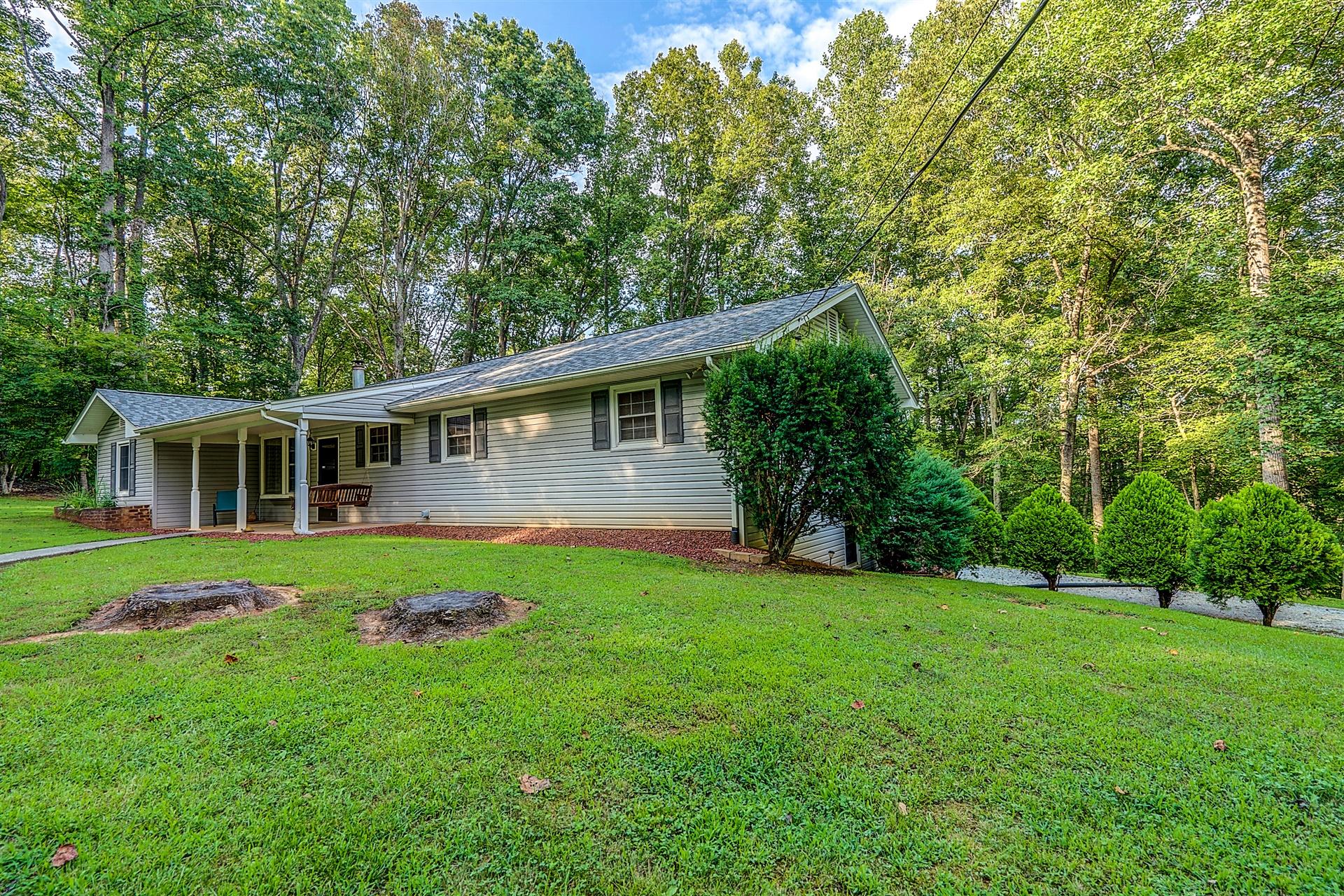 5960 Goodview Road Goodview, VA 24095 - Photo 4 of 38 a front view of a house with a yard