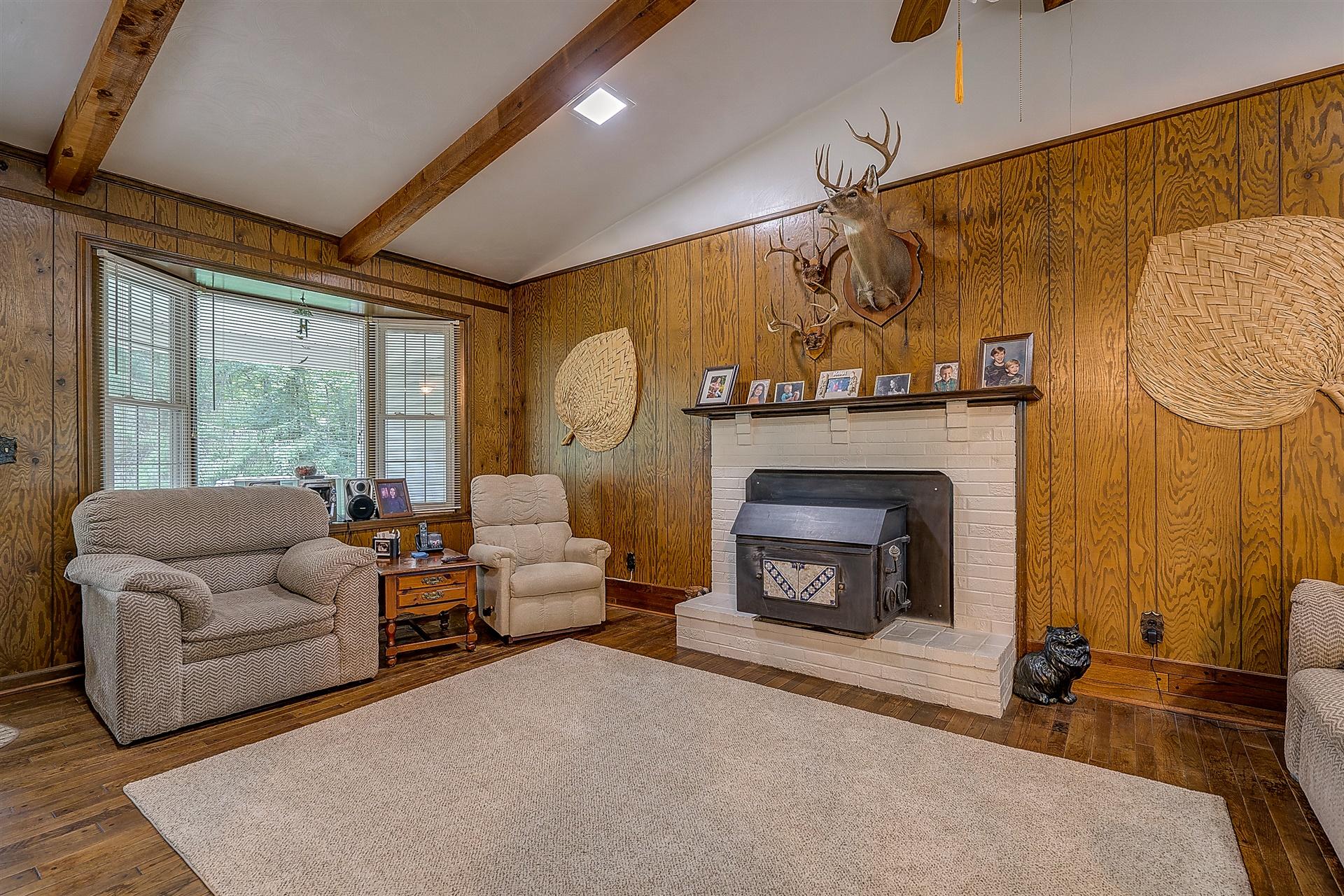 5960 Goodview Road Goodview, VA 24095 - Photo 7 of 38 a living room with furniture and a fireplace