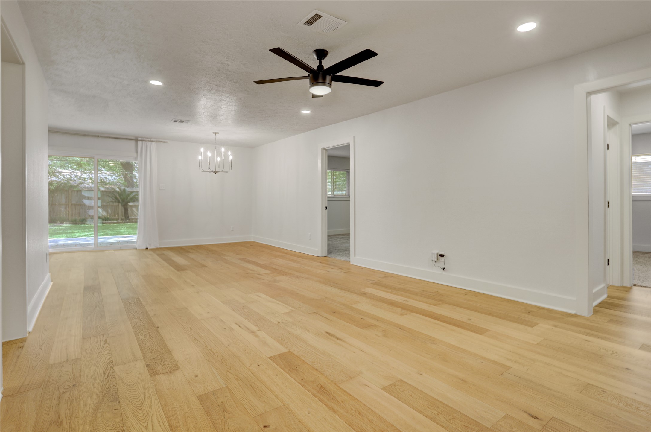 5514 Indigo Street Houston, TX 77096 - Photo 6 of 22 an empty room with a ceiling fan and window