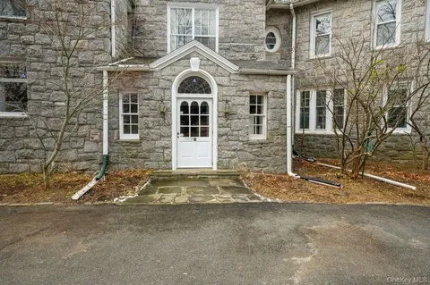 a view of wooden floor and windows in a room