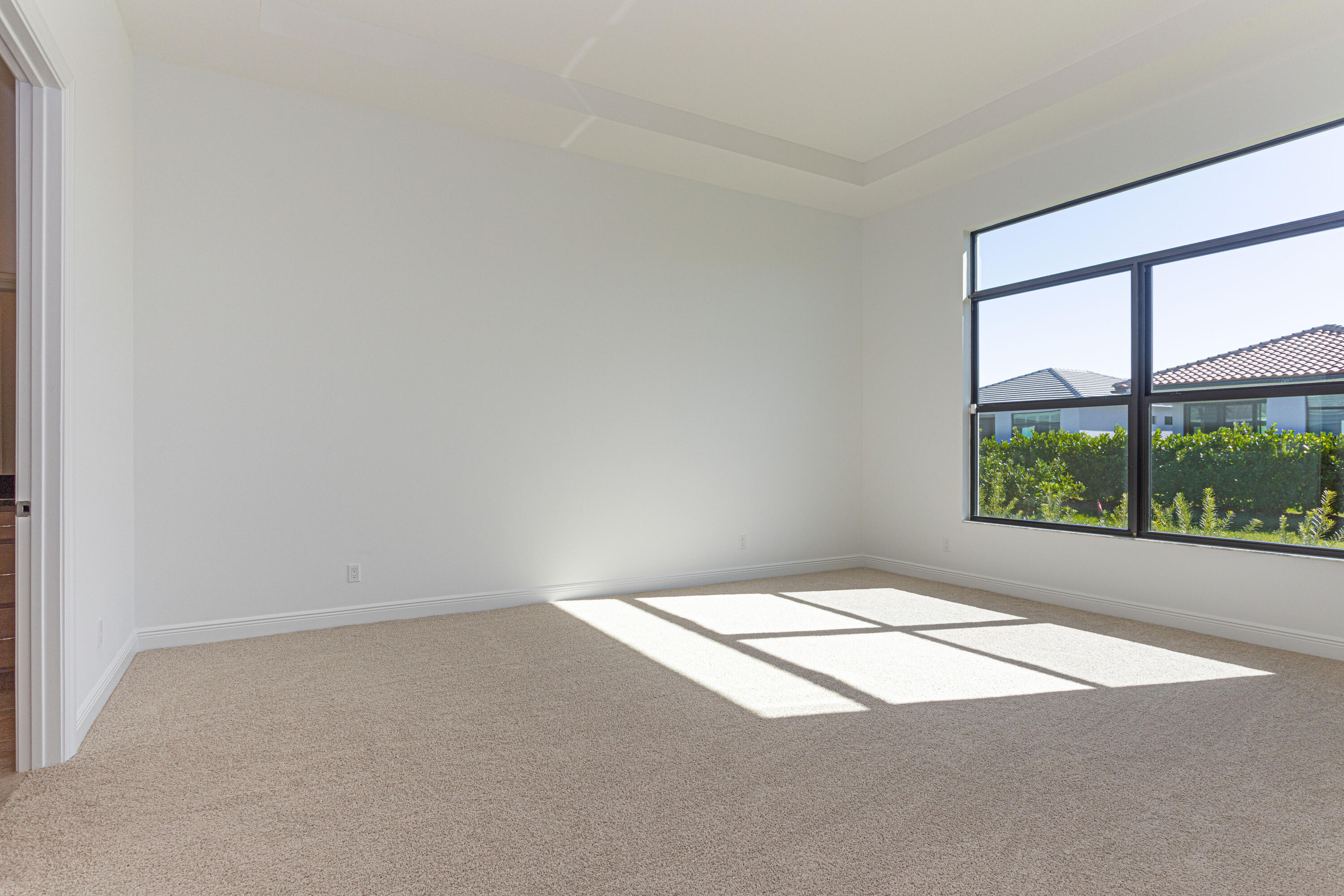 9155 Southwest Esule Way Port St. Lucie, FL 34987 - Photo 17 of 49 an empty room with a window
