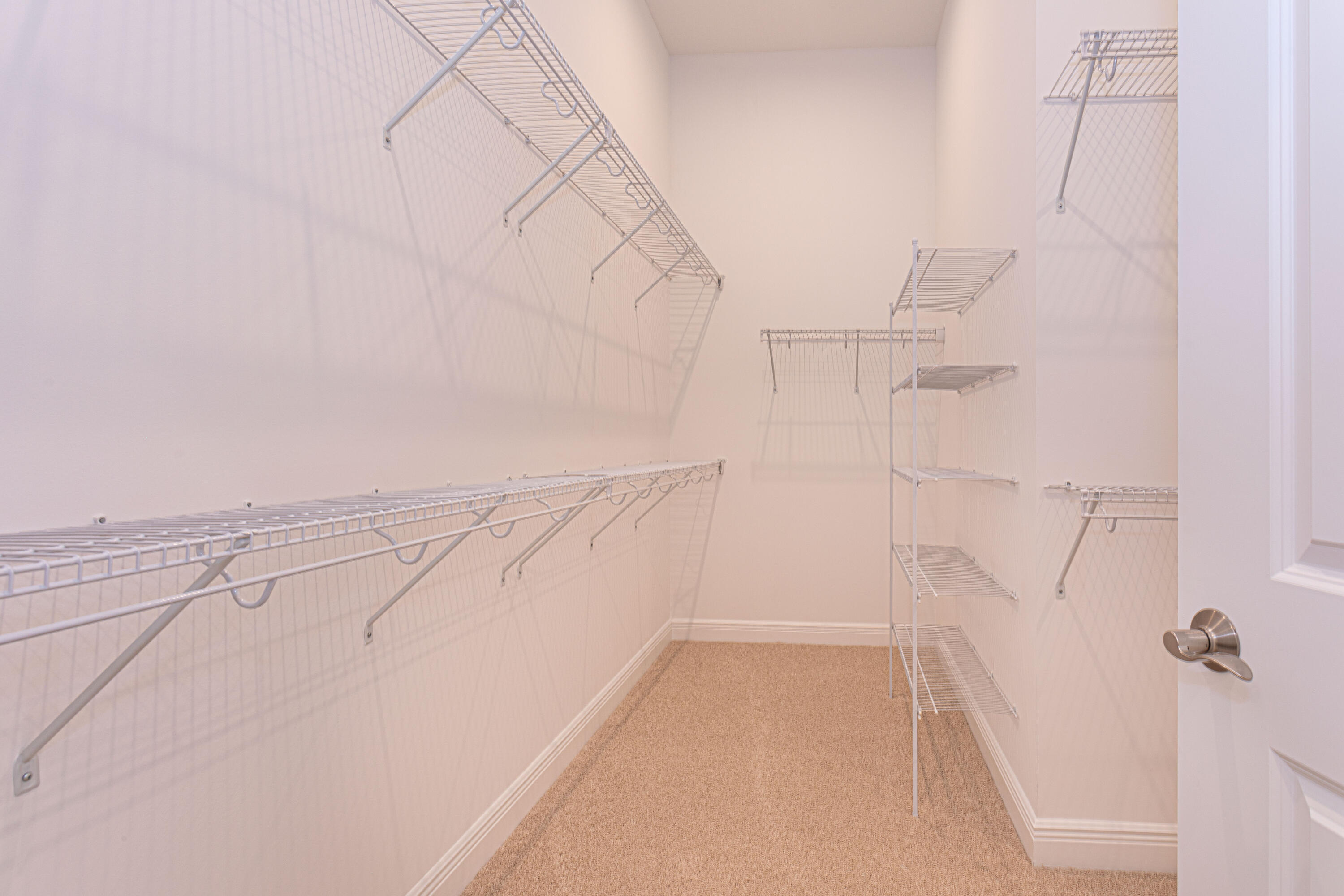 9155 Southwest Esule Way Port St. Lucie, FL 34987 - Photo 22 of 49 a view of small space with racks on the wall