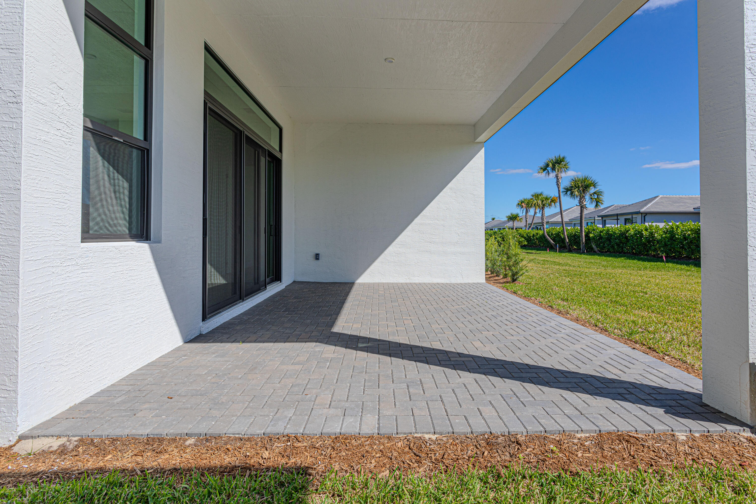 9155 Southwest Esule Way Port St. Lucie, FL 34987 - Photo 37 of 49 a view of a big room with potted plants and big yard