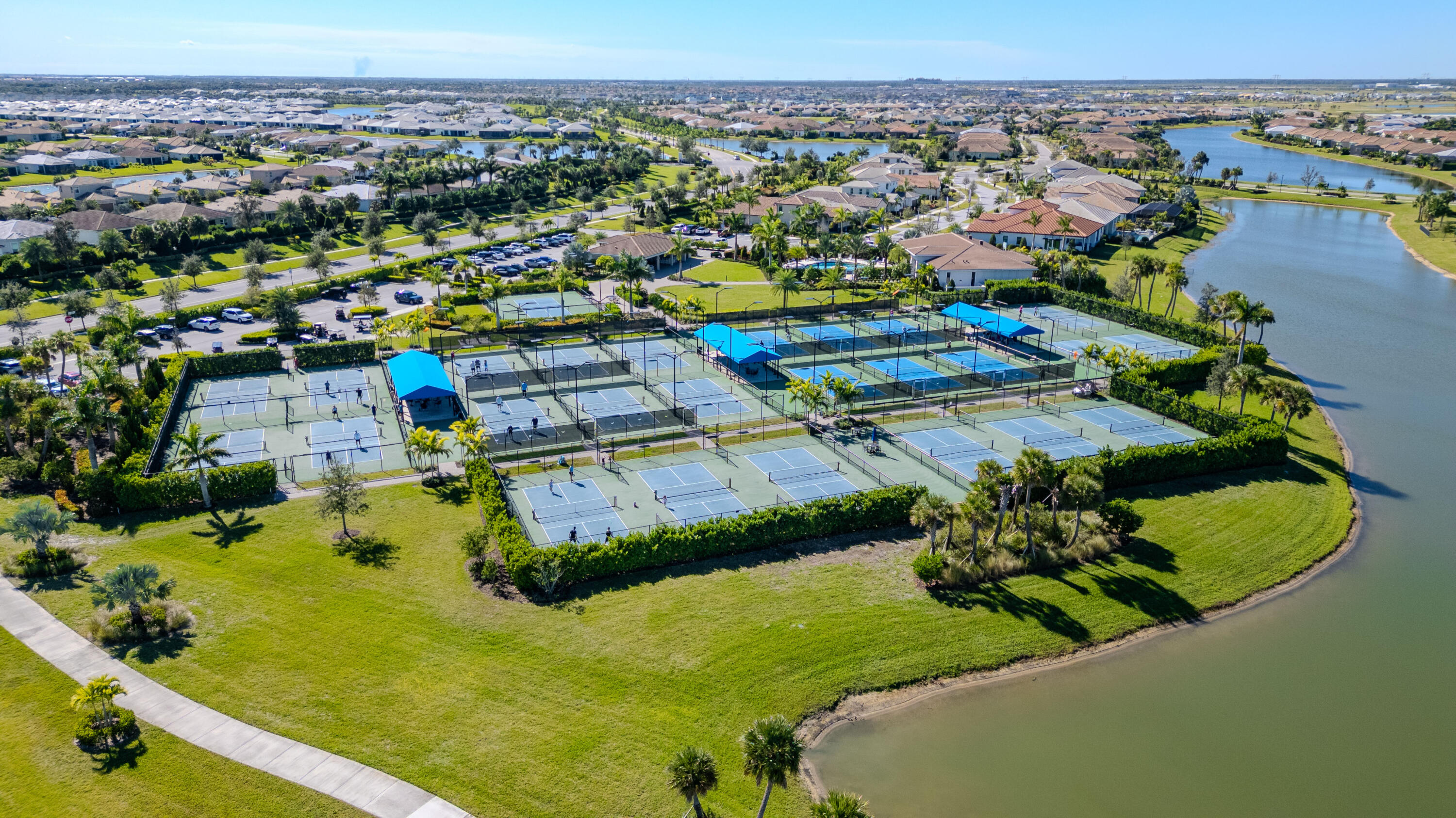 9155 Southwest Esule Way Port St. Lucie, FL 34987 - Photo 46 of 49 an aerial view of a houses with a swimming pool