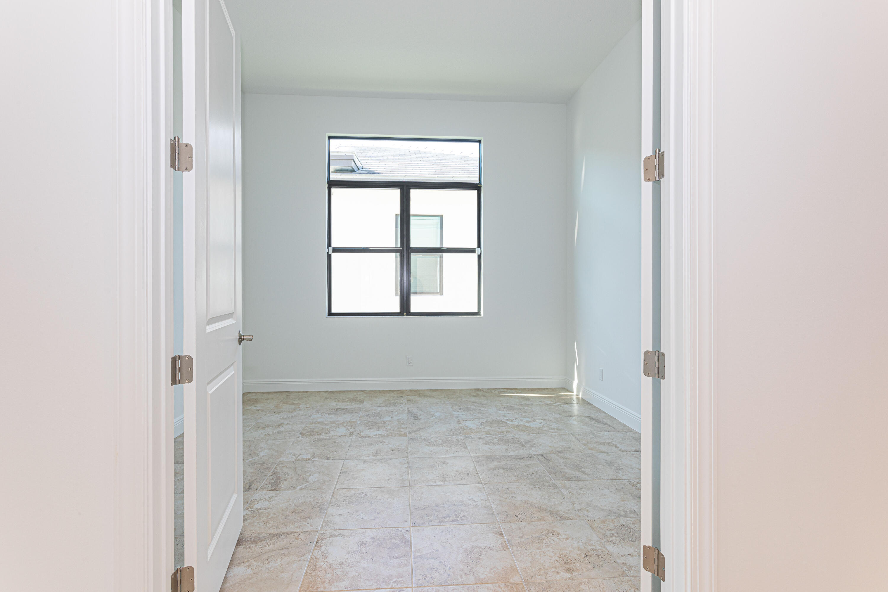 9155 Southwest Esule Way Port St. Lucie, FL 34987 - Photo 8 of 49 an empty room with windows