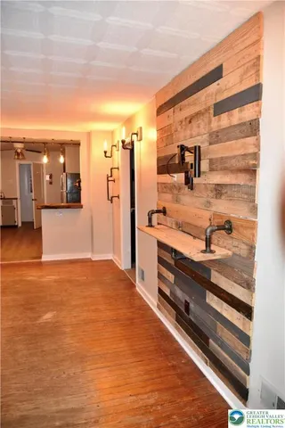 a view of a living room and kitchen with furniture