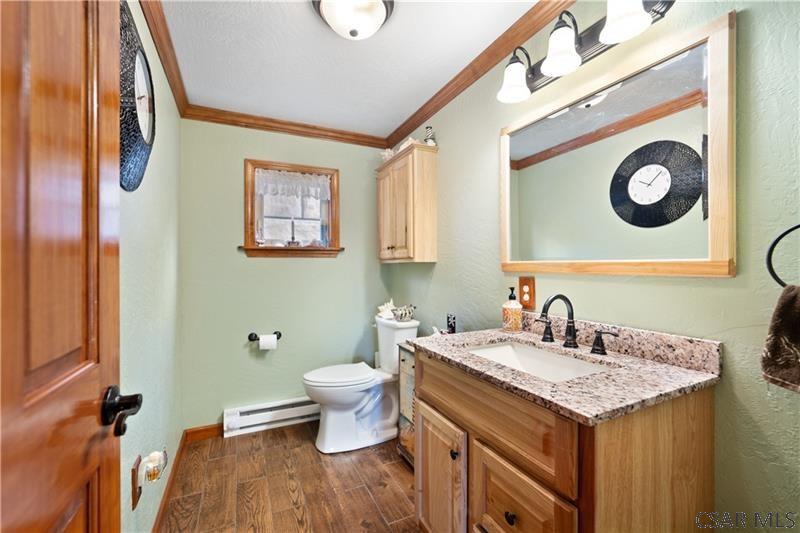 1073 New Berry Road Addison, PA 15411 - Photo 22 of 25 a bathroom with a sink and a mirror