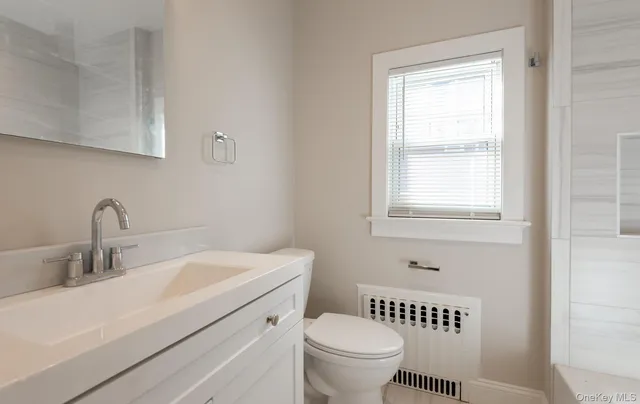 a bathroom with a sink toilet and a bathtub
