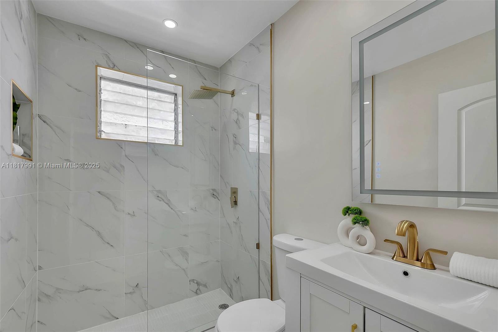 1852 Southwest 22nd Terrace, Unit 1 Miami, FL 33145 - Photo 13 of 24 a bathroom with a sink toilet and shower