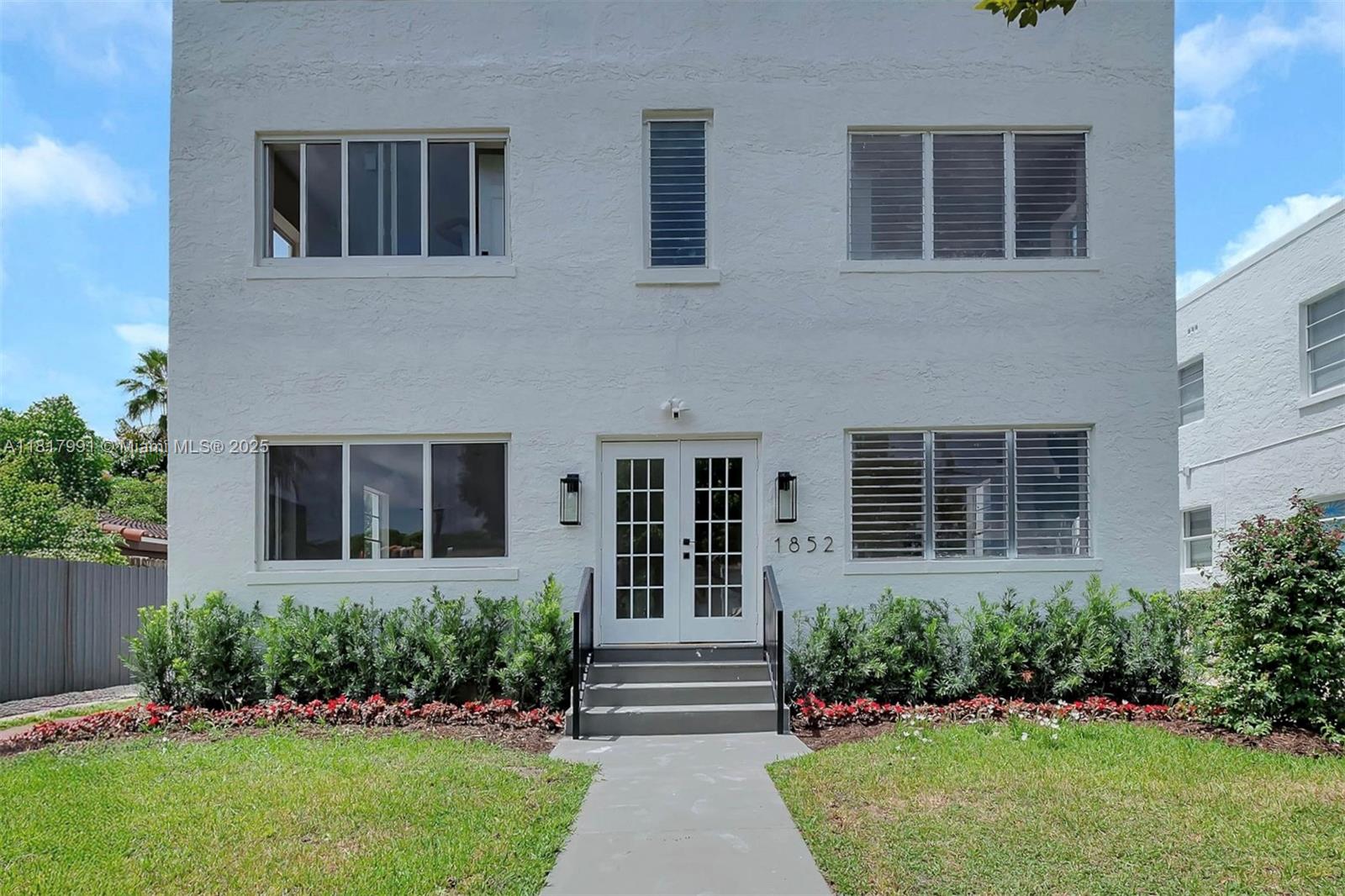 1852 Southwest 22nd Terrace, Unit 1 Miami, FL 33145 - Photo 20 of 24 a front view of a house with garden