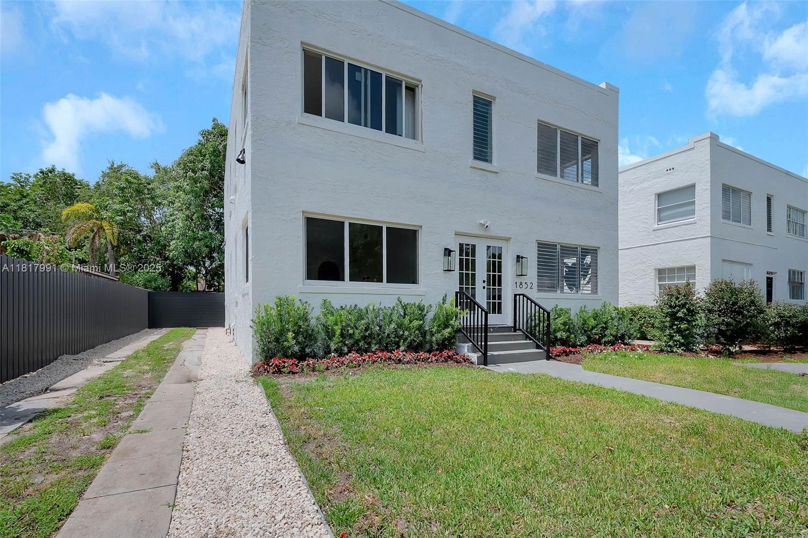 1852 Southwest 22nd Terrace, Unit 1 Miami, FL 33145 - Photo 21 of 24 a front view of house with yard and green space