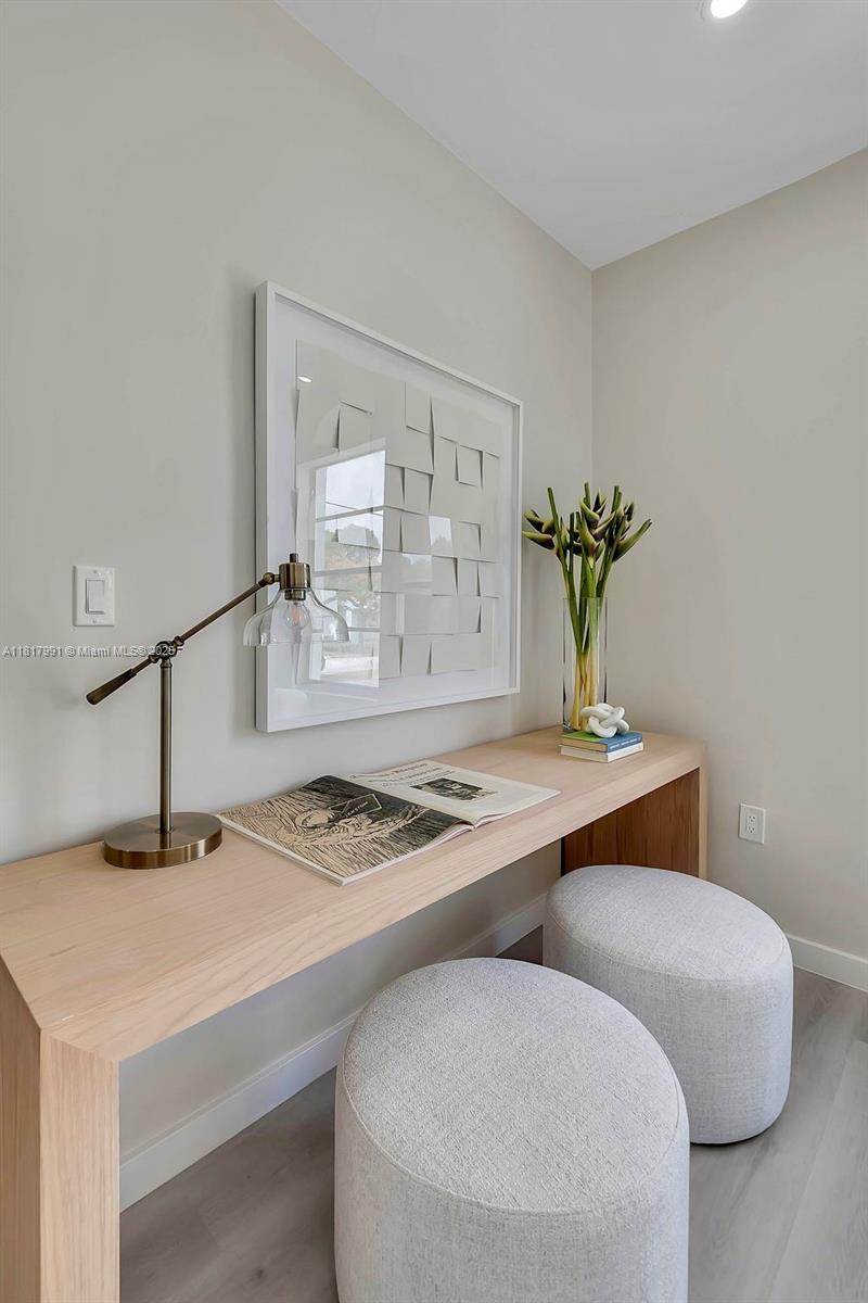 1852 Southwest 22nd Terrace, Unit 1 Miami, FL 33145 - Photo 5 of 24 a dining room with table chairs and kitchen view