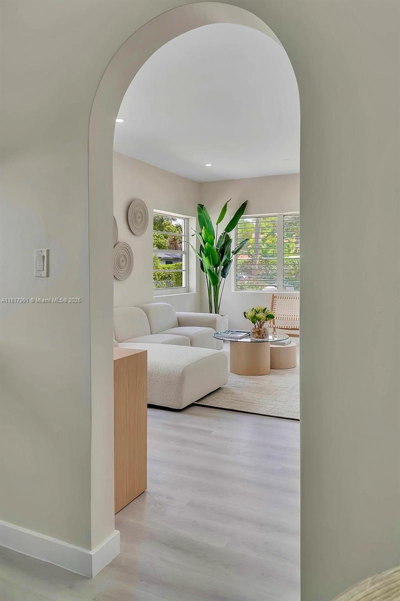 1852 Southwest 22nd Terrace, Unit 1 Miami, FL 33145 - Photo 7 of 24 a living room with furniture and a potted plant