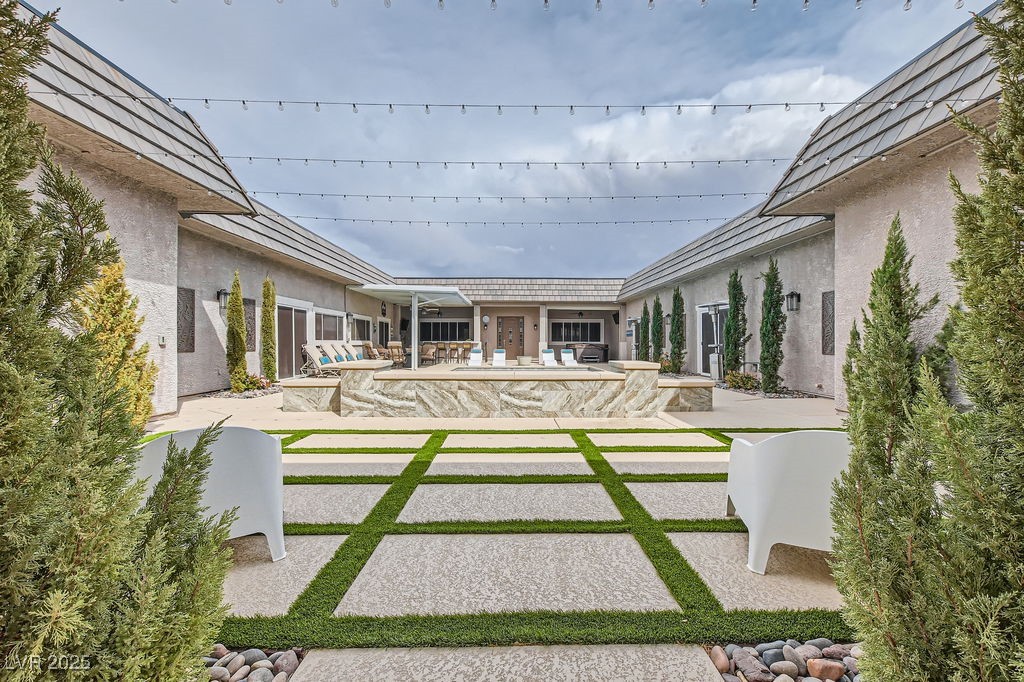 647 Foxhall Road Henderson, NV 89002 - Photo 46 of 82 View of yard featuring an outdoor pool and a patio area