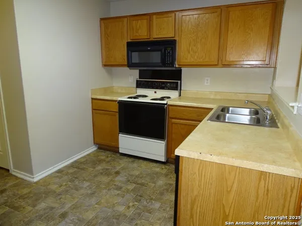 a view of cabinets and wooden floor