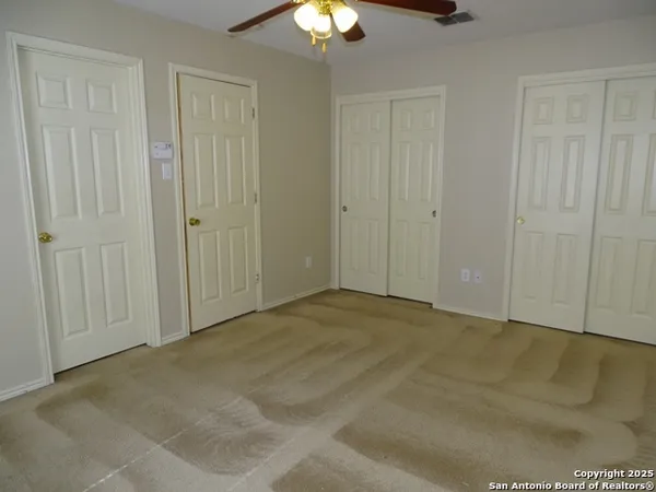 a white toilet sitting next to a bath tub