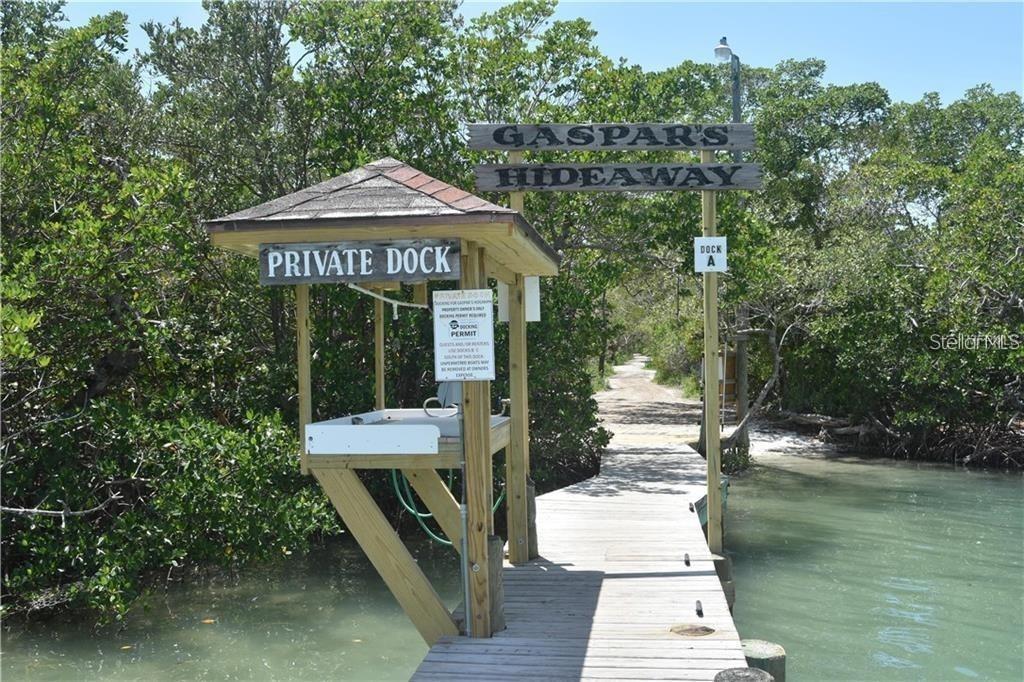 9598 Doubloon Trail Placida, FL 33946 - Photo 2 of 7 a front view of a house with a yard