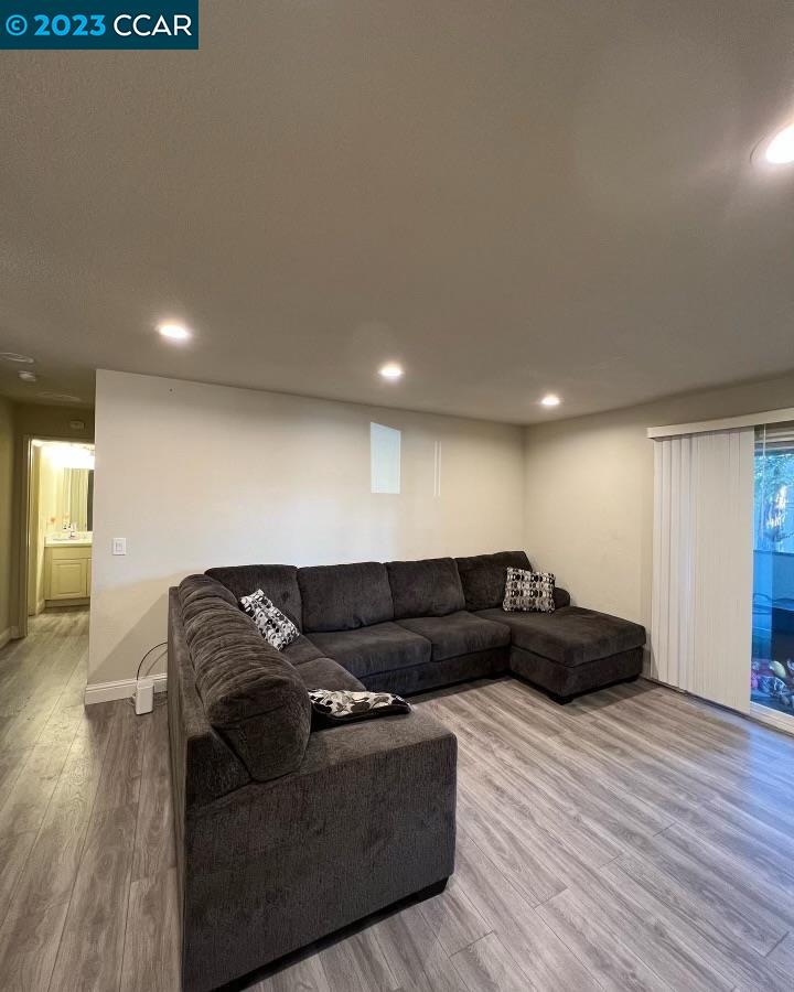 1505 Kirker Pass Road, Unit 264 Concord, CA 94521 - Photo 1 of 1 a living room with furniture and a wooden floor