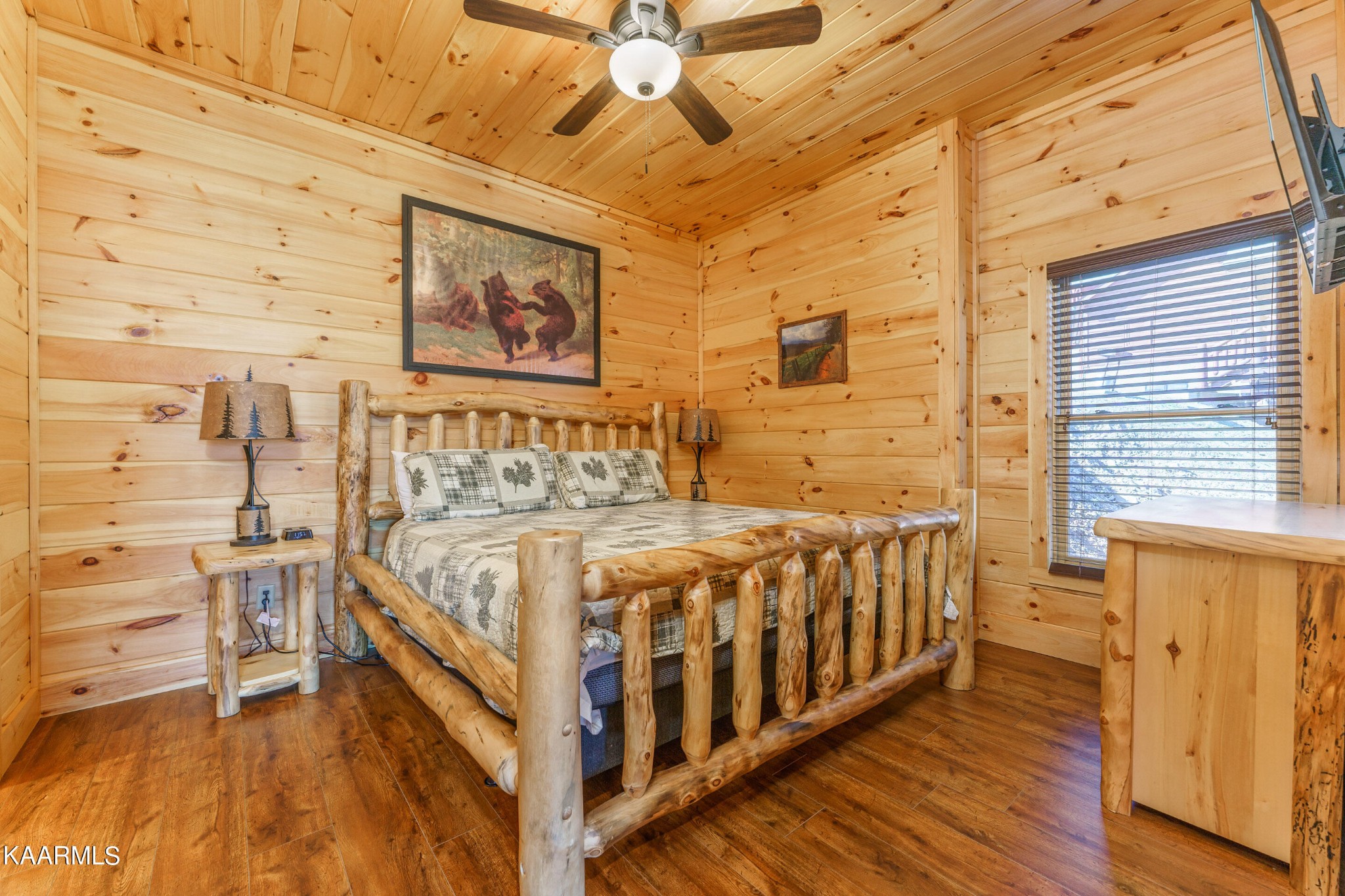 2805 White Oak Ridge Lane Sevierville, TN 37862 - Photo 15 of 25 a large bed sitting in a room next to a window