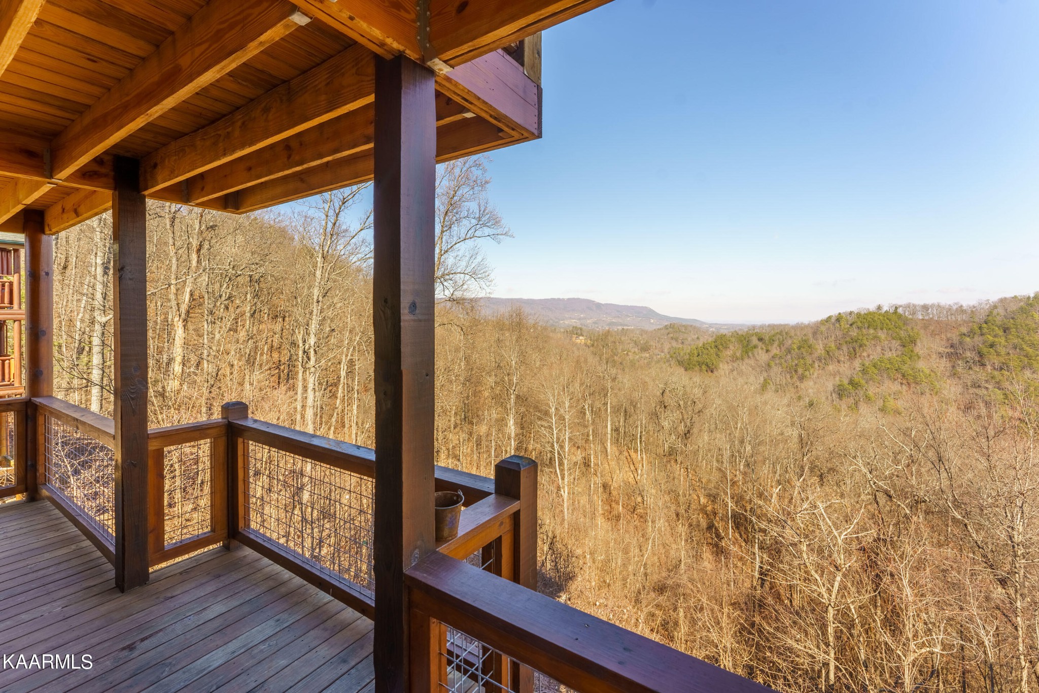 2805 White Oak Ridge Lane Sevierville, TN 37862 - Photo 21 of 25 a view of a balcony with furniture and wooden floor