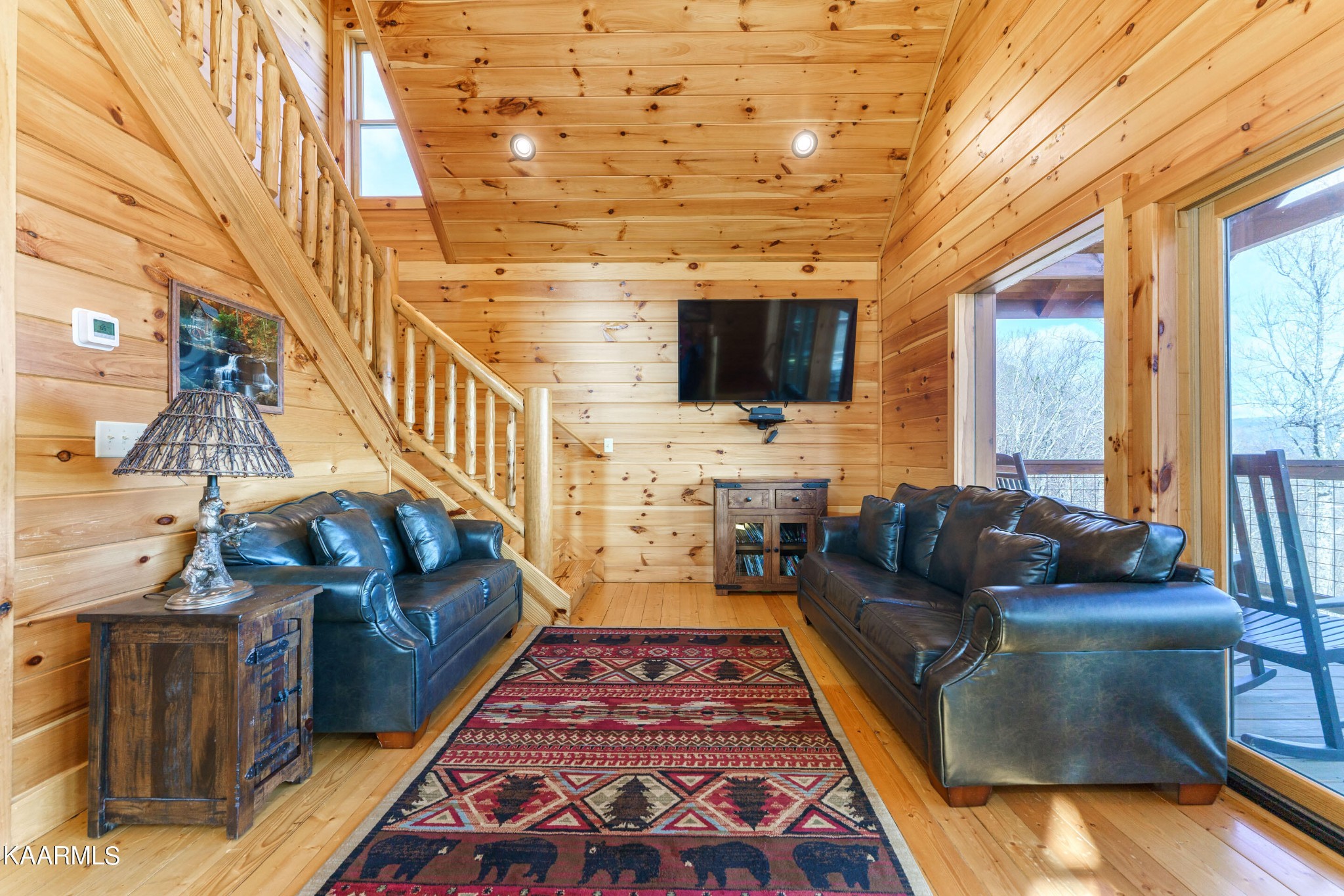 2805 White Oak Ridge Lane Sevierville, TN 37862 - Photo 4 of 25 a living room with furniture wooden floor and a flat screen tv
