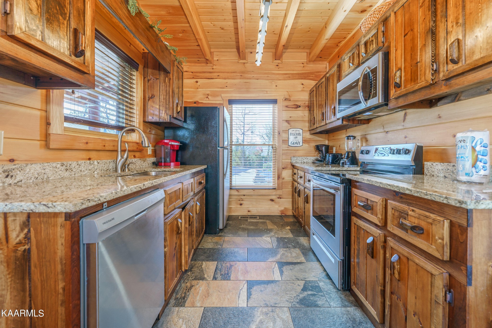 2805 White Oak Ridge Lane Sevierville, TN 37862 - Photo 8 of 25 a kitchen with stainless steel appliances granite countertop a sink and dishwasher