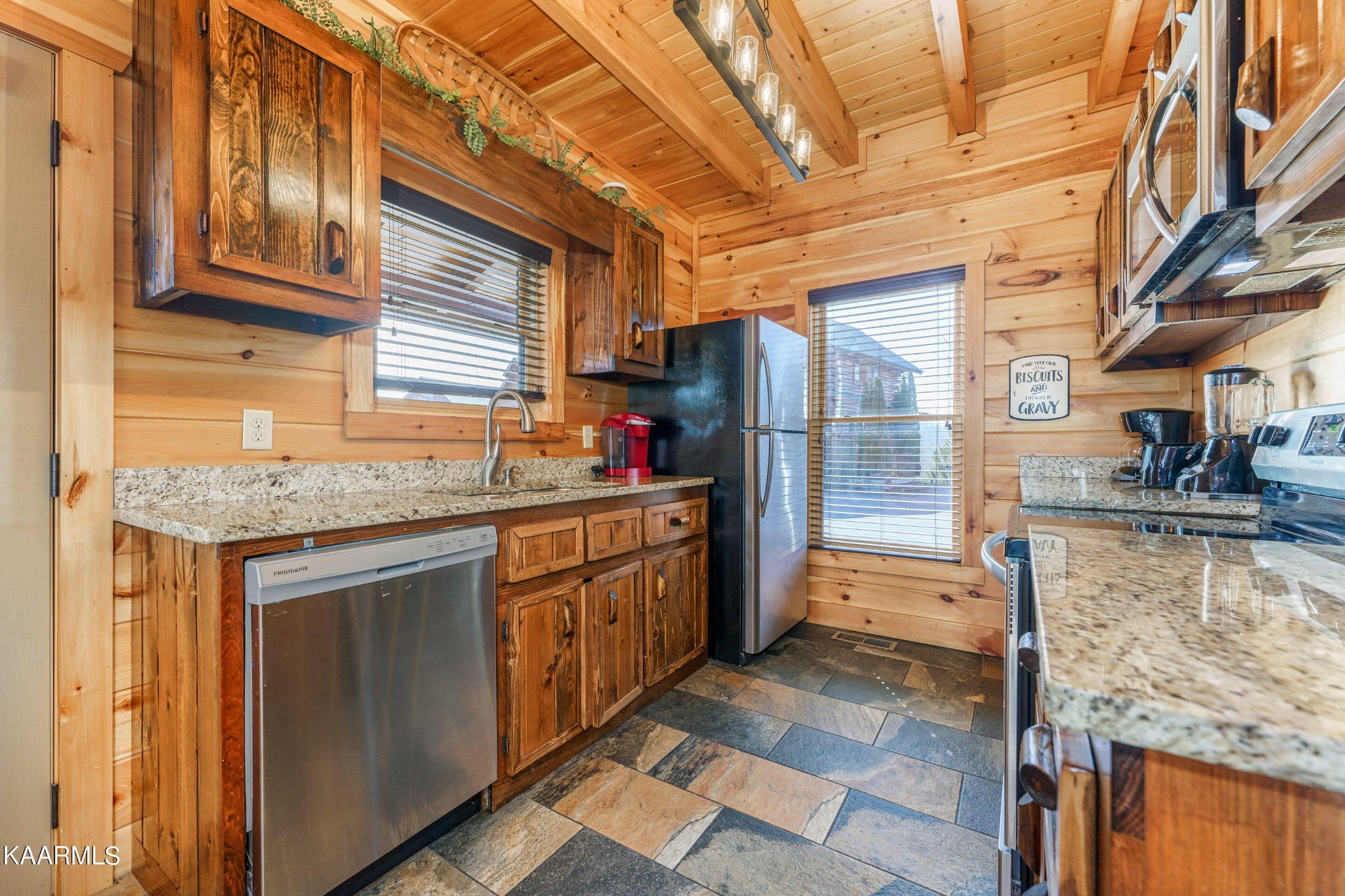 2805 White Oak Ridge Lane Sevierville, TN 37862 - Photo 9 of 25 a kitchen with stainless steel appliances granite countertop a refrigerator and a sink
