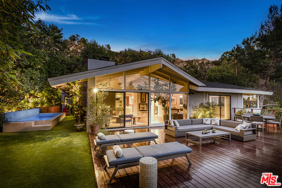 a view of swimming pool with outdoor seating