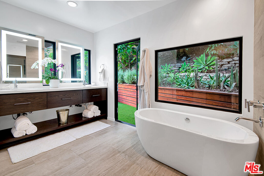 1633 Queens Road Los Angeles, CA 90069 - Photo 11 of 16 a living room with furniture and a large window