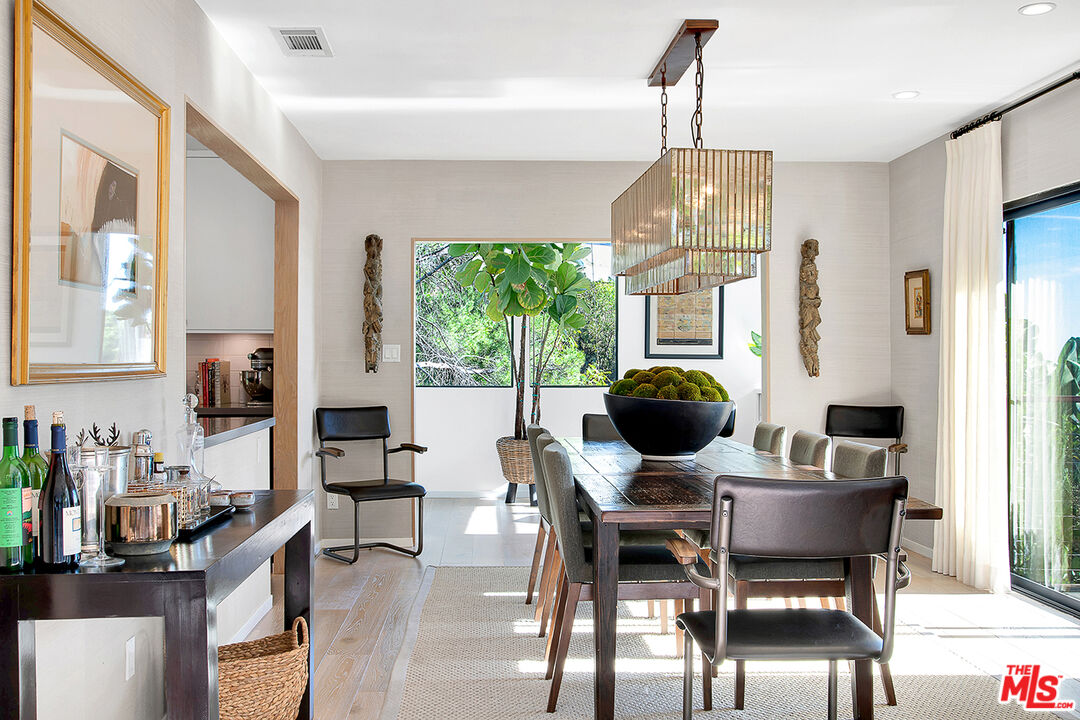 1633 Queens Road Los Angeles, CA 90069 - Photo 4 of 16 a view of a dining room with furniture window and outside view