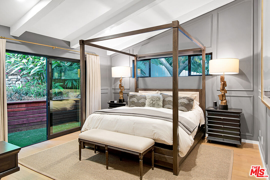 1633 Queens Road Los Angeles, CA 90069 - Photo 9 of 16 a bedroom with a bed and a view of balcony