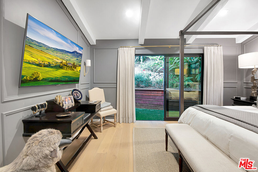 1633 Queens Road Los Angeles, CA 90069 - Photo 10 of 16 a bedroom with furniture and a flat screen tv