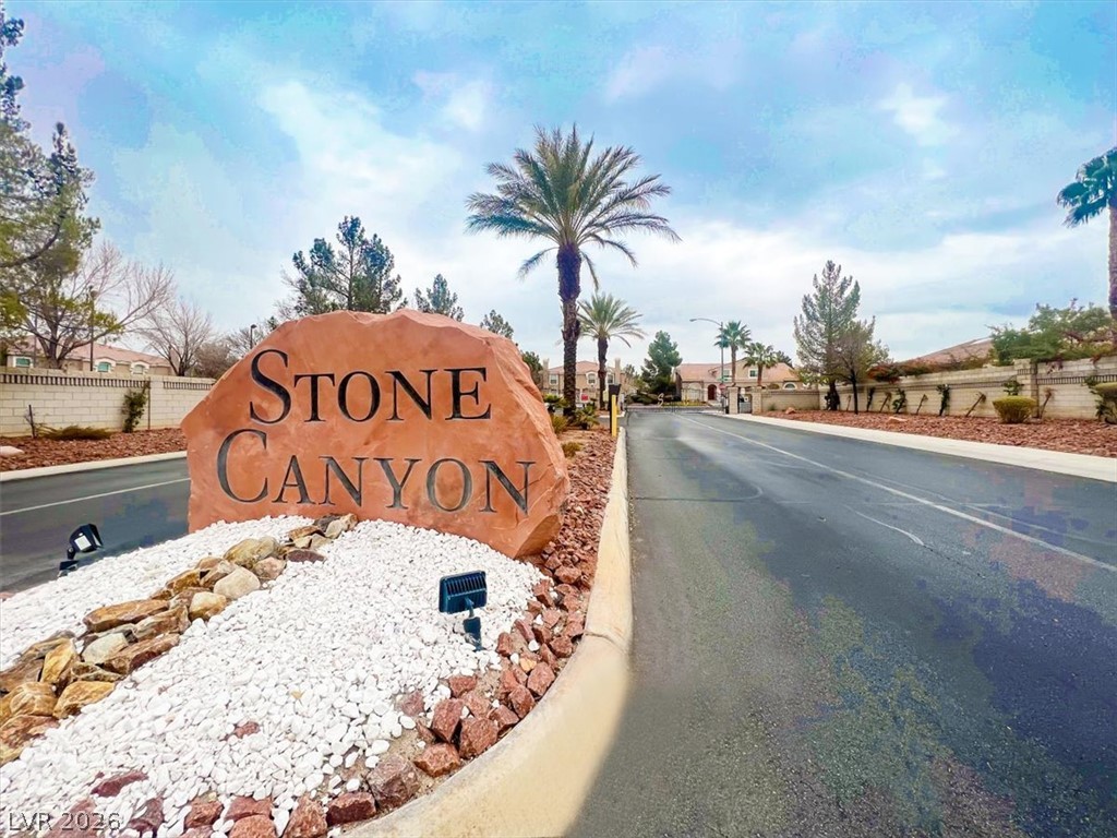 10148 Tree Bark Street Las Vegas, NV 89183 - Photo 31 of 37 Enter through a grand stone monument welcoming residents to Stone Canyon.